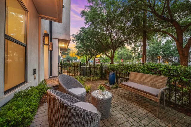 balcony at dusk with a patio area