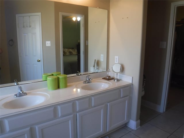full bath with tile patterned flooring, a sink, and double vanity