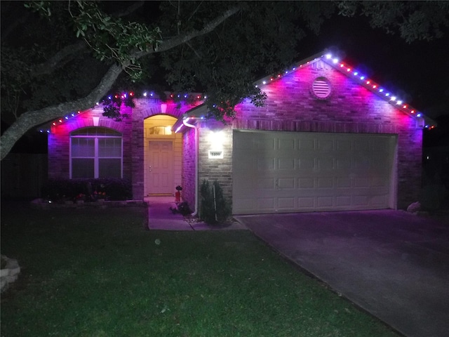 1409 Barras St, Alvin, TX 77511 - view of front of house with concrete driveway, an attached garage, and stone siding