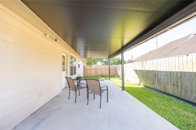1409 Barras St, Alvin, TX 77511 - view of patio featuring a fenced backyard