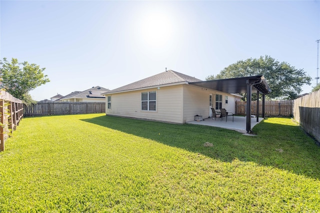 1409 Barras St, Alvin, TX 77511 - rear view of property featuring a patio area