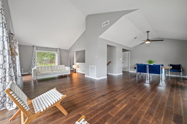 living area with wood finished floors, visible vents, a ceiling fan, and high vaulted ceiling