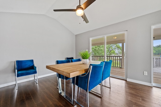 dining room with wood finished floors, ceiling fan, vaulted ceiling, and baseboards