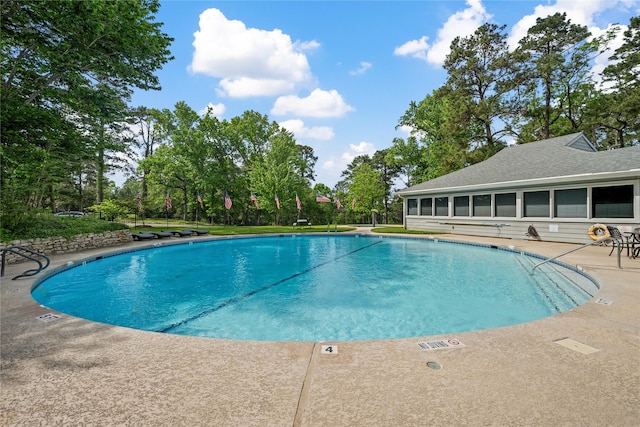 community pool with a patio