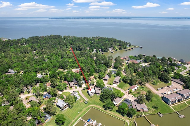 birds eye view of property with a water view and a residential view