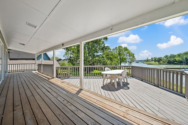 wooden deck featuring a water view