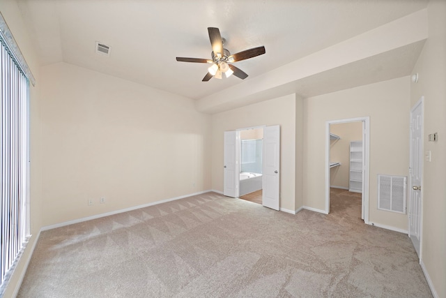 unfurnished bedroom featuring a closet, visible vents, and light colored carpet