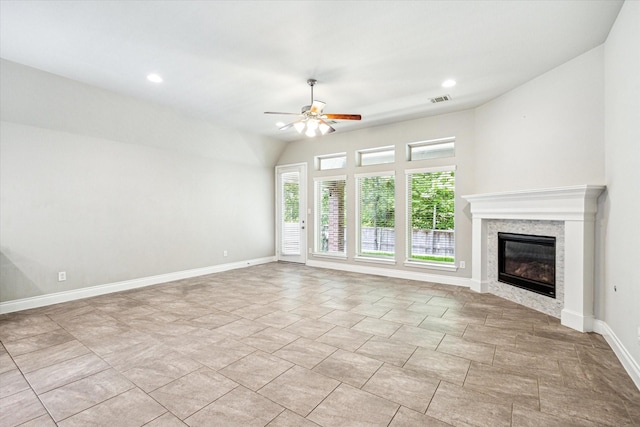unfurnished living room featuring recessed lighting, ceiling fan, a premium fireplace, baseboards, and visible vents