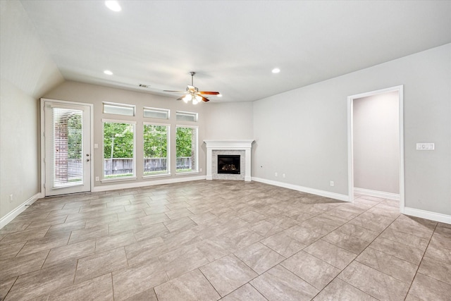 unfurnished living room featuring baseboards, recessed lighting, a ceiling fan, and a high end fireplace