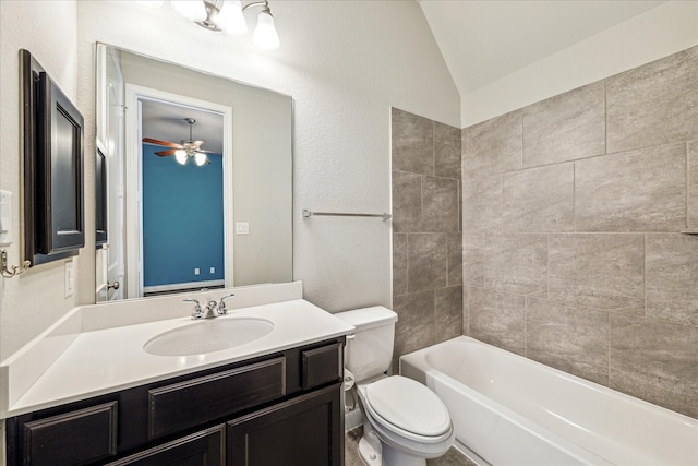 full bath with vaulted ceiling, toilet, a textured wall, vanity, and a ceiling fan