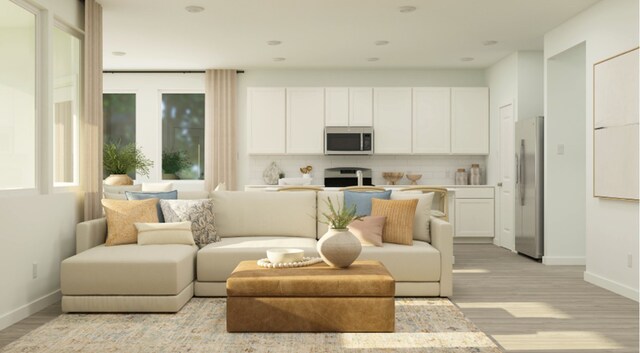 living room with light wood-type flooring and baseboards