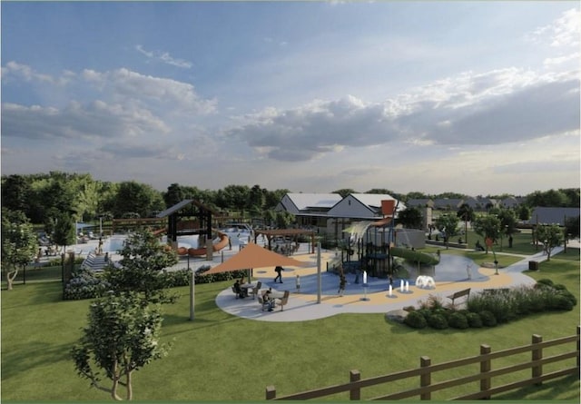 view of property's community featuring a yard and playground community