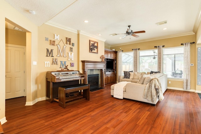 living room featuring ceiling fan, visible vents, baseboards, a high end fireplace, and dark wood finished floors