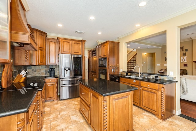 kitchen featuring a sink, crown molding, black appliances, a kitchen island, and premium range hood