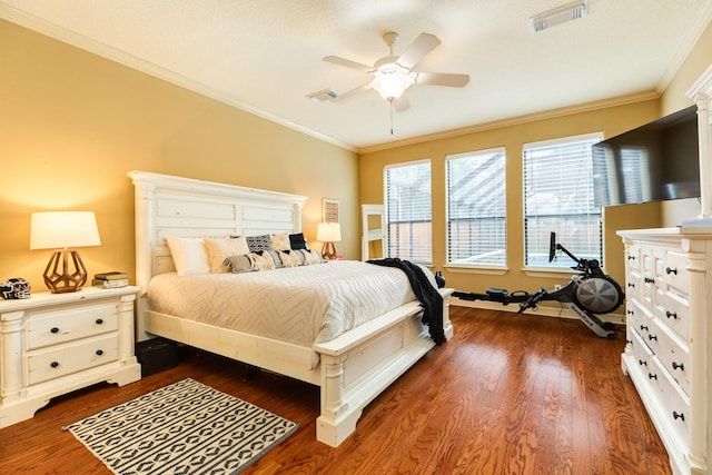 bedroom with visible vents, ceiling fan, ornamental molding, and dark wood-style floors