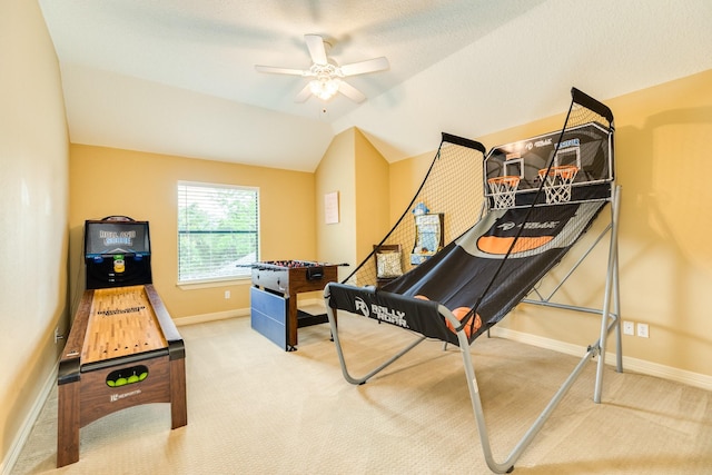 recreation room featuring lofted ceiling, ceiling fan, carpet flooring, and baseboards