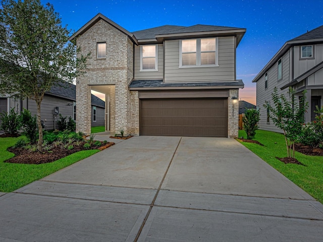 21711 White Bellflower Ln, Cypress, TX 77433 - view of front of home with brick siding, a garage, concrete driveway, and a front yard
