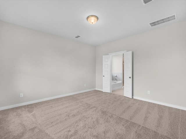 21711 White Bellflower Ln, Cypress, TX 77433 - unfurnished bedroom featuring carpet and ensuite bathroom