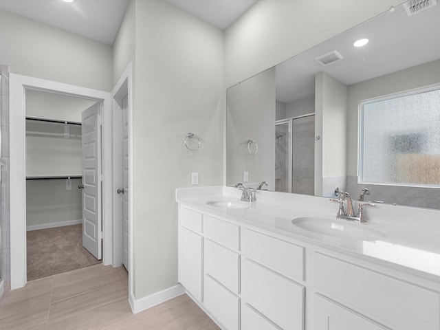 21711 White Bellflower Ln, Cypress, TX 77433 - full bathroom with a shower stall, a walk in closet, and double vanity
