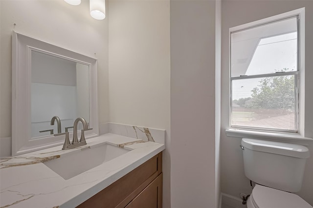 half bath with toilet and vanity