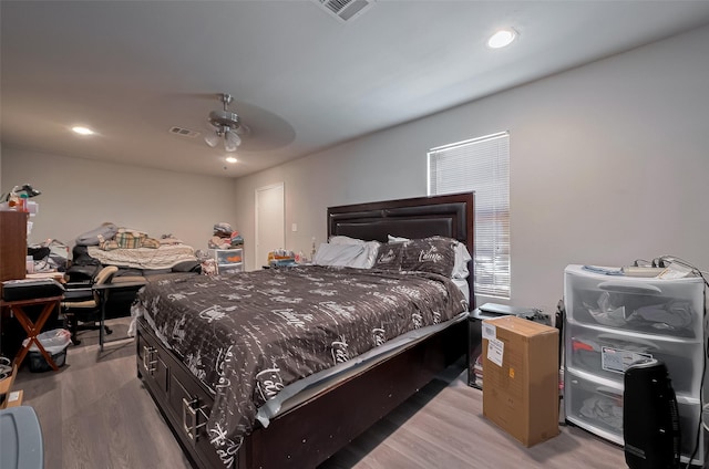 bedroom with visible vents, a ceiling fan, light wood finished floors, and recessed lighting