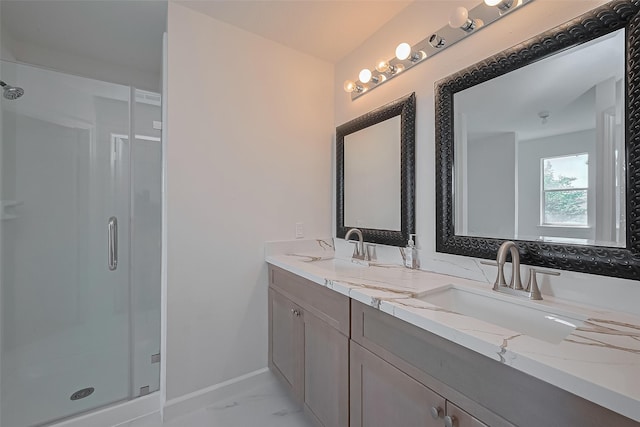 full bathroom with a shower stall, baseboards, marble finish floor, and a sink
