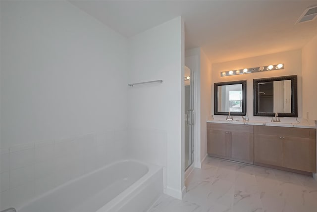 bathroom with a sink, visible vents, a stall shower, a garden tub, and marble finish floor