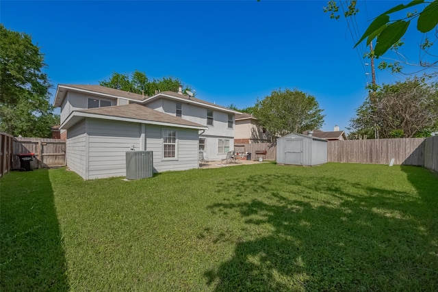 back of house featuring an outdoor structure, a patio, a storage unit, and a fenced backyard