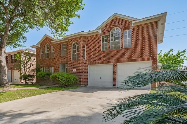 view of front of property with driveway, brick siding, and an attached garage