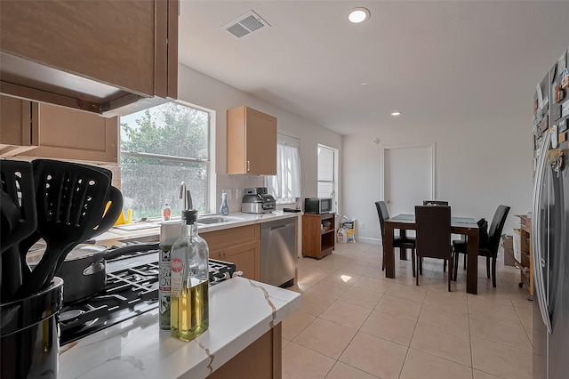 kitchen with recessed lighting, a sink, decorative backsplash, visible vents, and appliances with stainless steel finishes