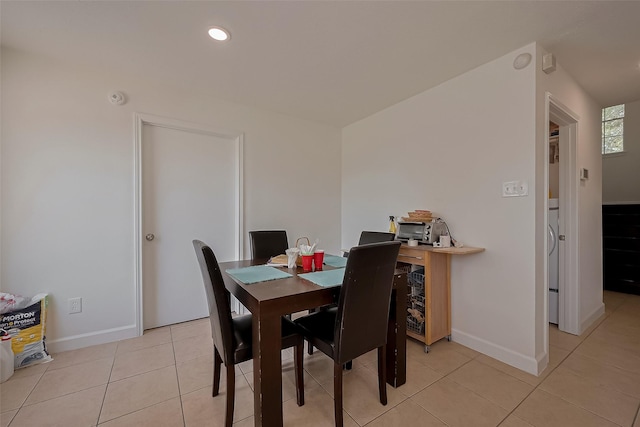 dining area featuring baseboards, recessed lighting, and light tile patterned floors