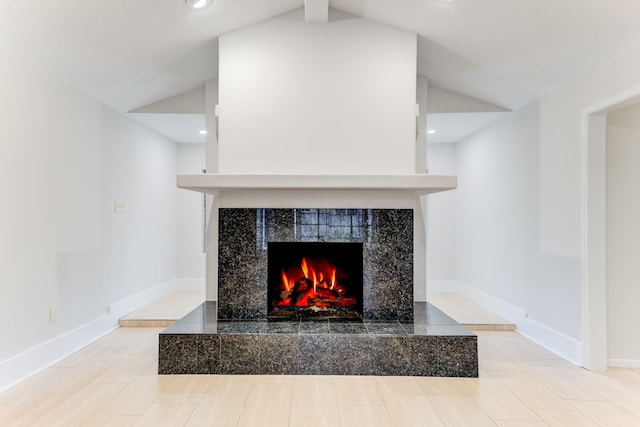 room details with baseboards, recessed lighting, and a fireplace