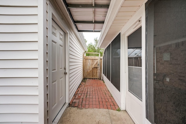 view of home's exterior with a gate