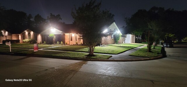 view of front of house with a yard
