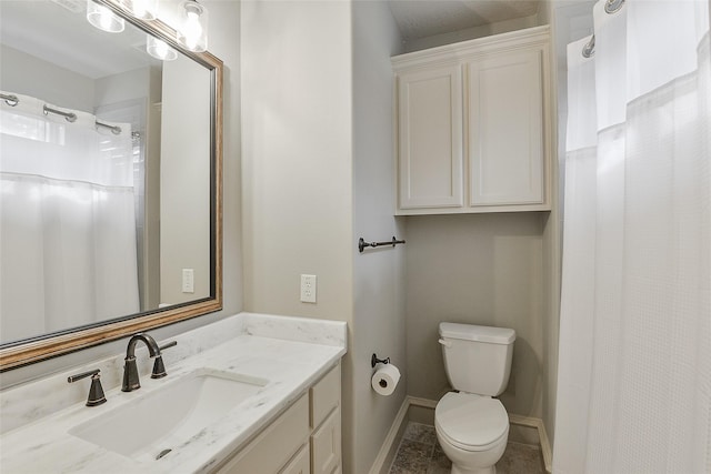 bathroom featuring vanity, curtained shower, toilet, baseboards, and tile patterned floors