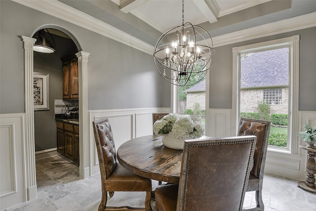 1330 Royal Sands Ln, Houston, TX 77345 - dining area with wainscoting, a decorative wall, beamed ceiling, ornamental molding, and a chandelier