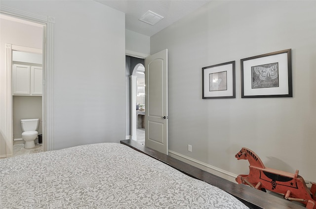 1330 Royal Sands Ln, Houston, TX 77345 - bedroom with wood finished floors, baseboards, and connected bathroom
