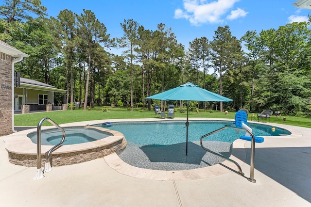 view of pool featuring a lawn, a patio, and a pool with connected hot tub
