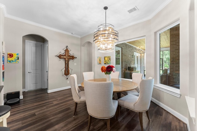 dining area with dark wood-style floors, a chandelier, visible vents, baseboards, and arched walkways