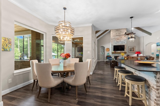 dining space with arched walkways, dark wood-style flooring, baseboards, and ceiling fan with notable chandelier