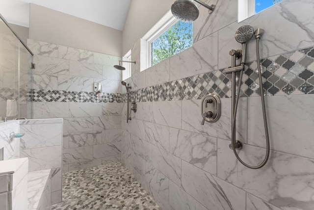 full bathroom with a tile shower