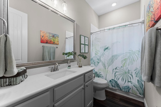 full bathroom with a shower with curtain, recessed lighting, vanity, toilet, and wood finished floors