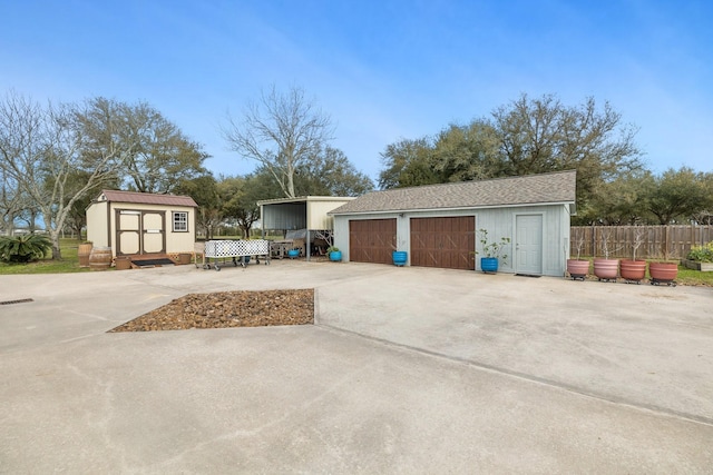 exterior space with fence and a shed