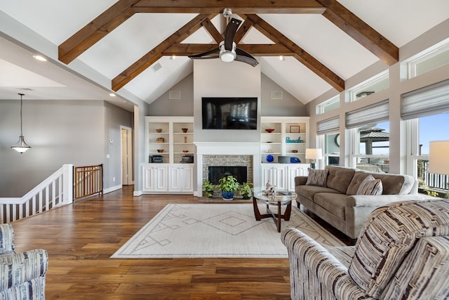living room with high vaulted ceiling, beamed ceiling, ceiling fan, and wood finished floors