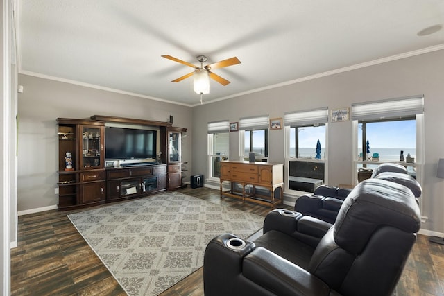 living room with ornamental molding, ceiling fan, wood finished floors, and baseboards