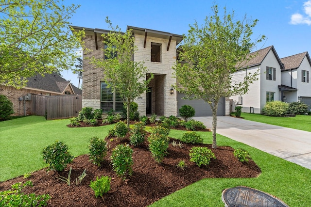 view of front of home with a front yard, fence, driveway, and stone siding