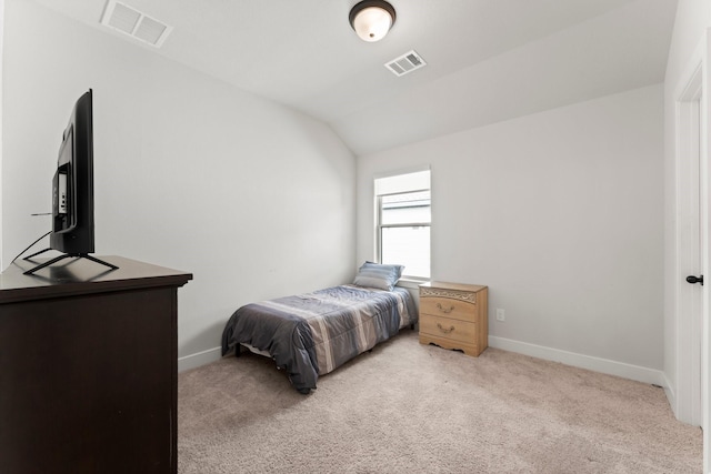 bedroom featuring visible vents, baseboards, and lofted ceiling