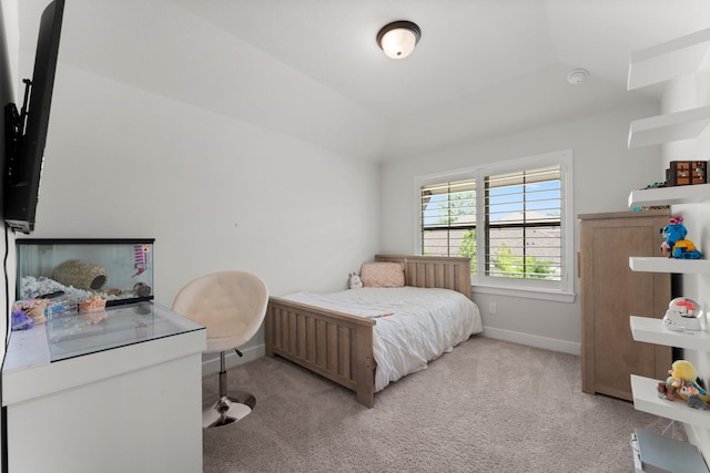 bedroom featuring baseboards and light carpet