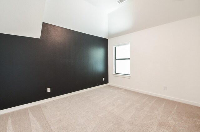 202 Calm Savanna Ct, Conroe, TX 77318 - unfurnished room featuring light colored carpet, baseboards, and high vaulted ceiling