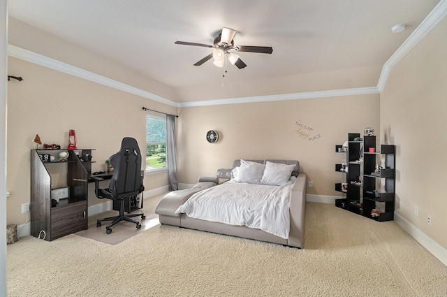 carpeted bedroom featuring ornamental molding, baseboards, a ceiling fan, and an office area